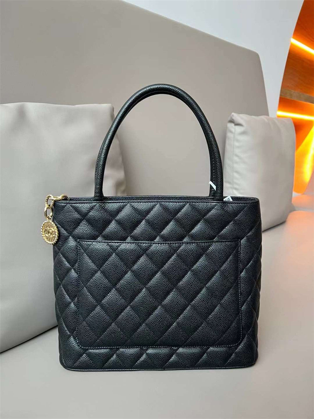 Chanel inspired Caviar Medallion Tote in black bag