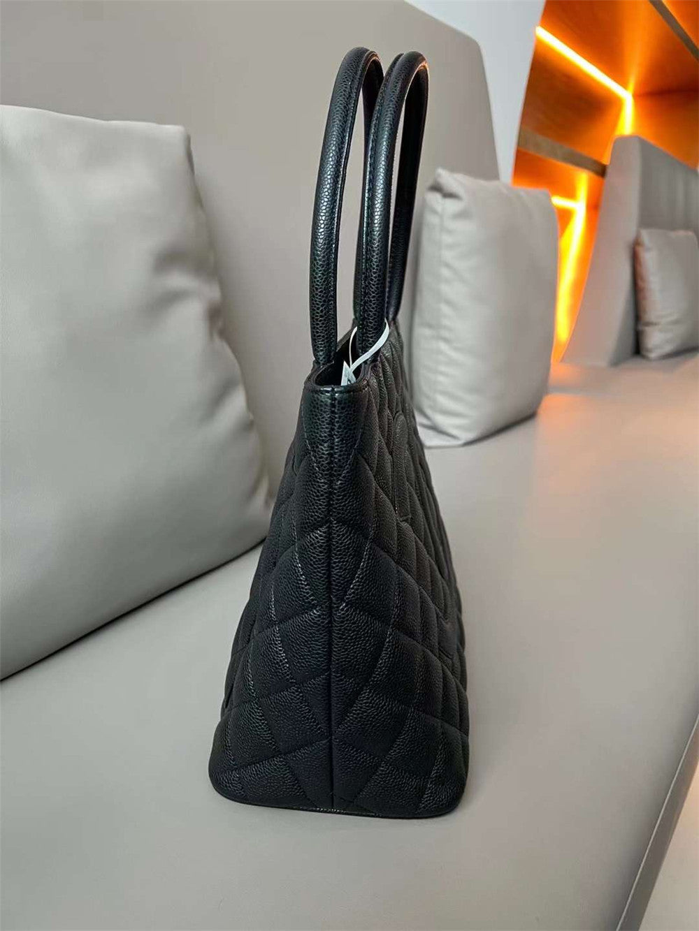 Chanel inspired Caviar Medallion Tote in black bag